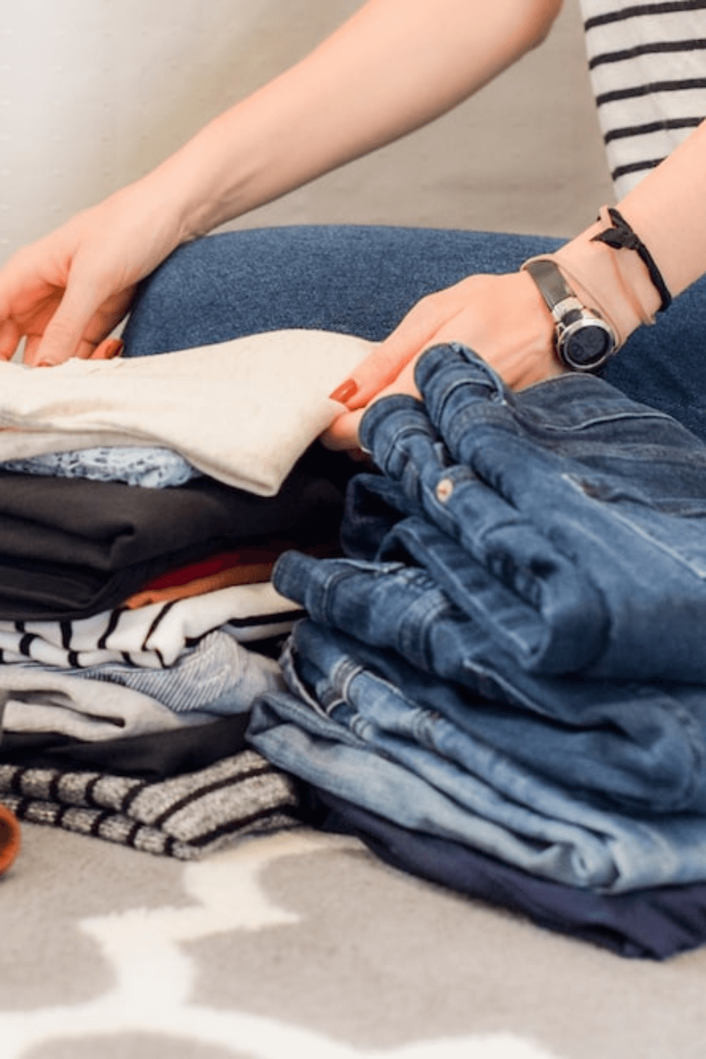 A woman is sorting clothes